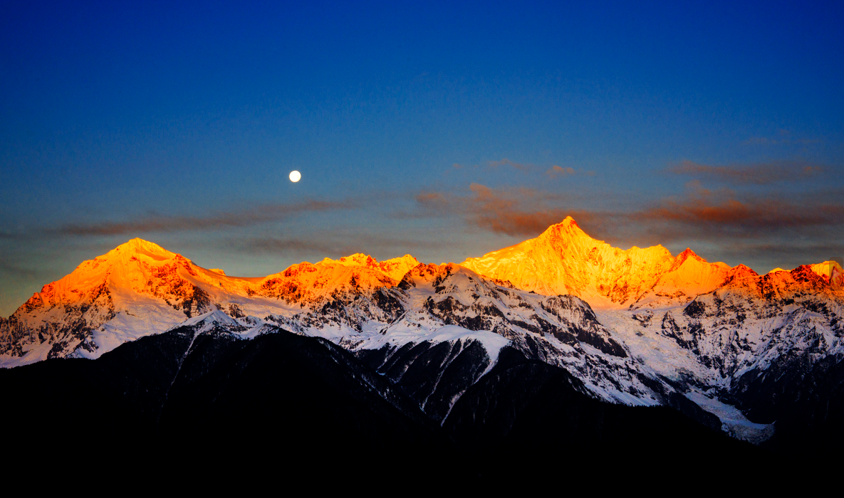 Golden glow on Meili Snow Mountains